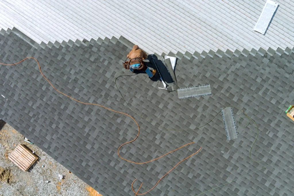 roofer installing shingles