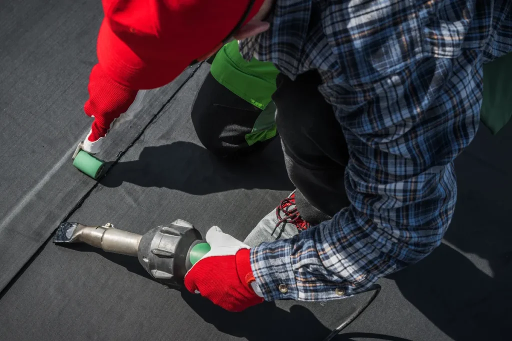 worker repairing a commercial EPDM roof