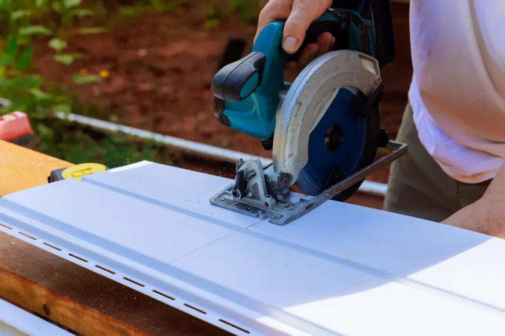cutting a piece of siding