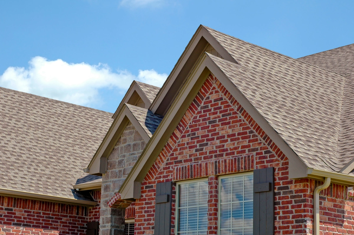 front of brick home with asphalt shingles in Covington, KY