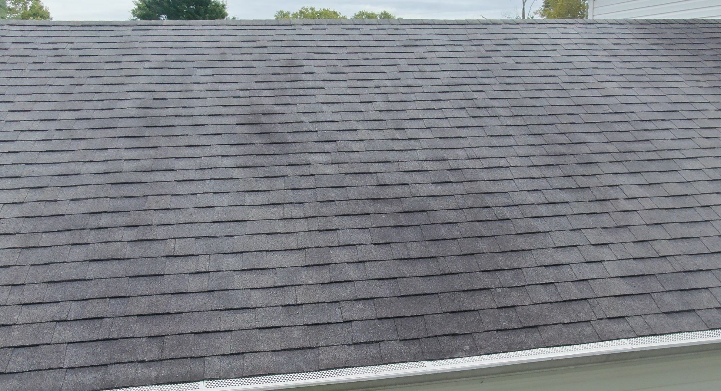 Discolored shingles on a roof